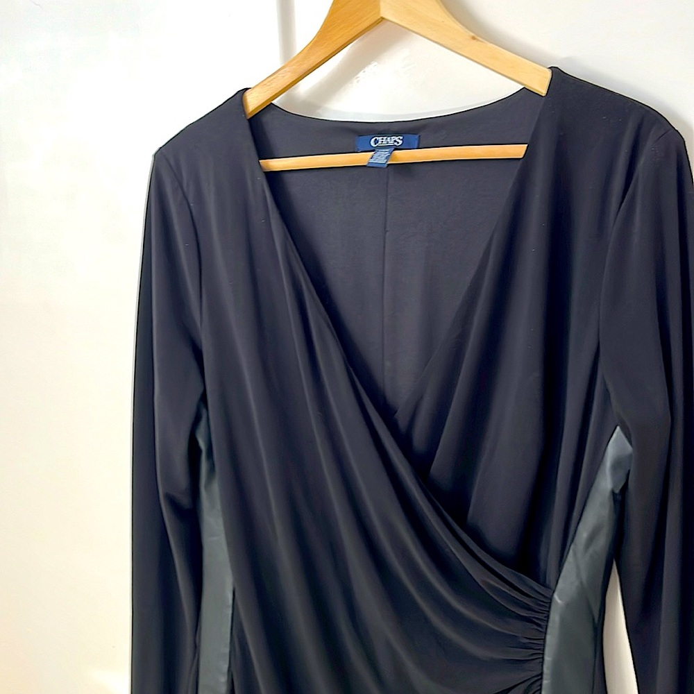 Black dress with faux leather trim down each side.  Never worn.